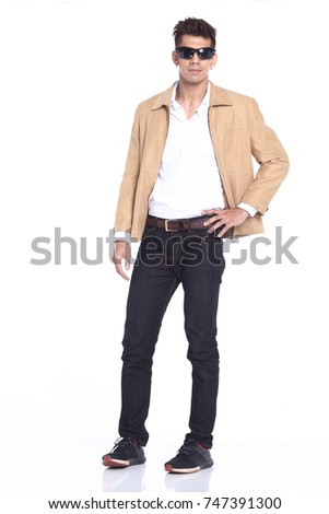 Full Length Snap Figure, casual Man Stand in white shirt cream jacket black jean pants sun glasses, studio lighting white background isolated, Asian Male Model happy smile