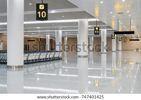 modern airport hall interior with nobody Royalty-Free Stock Photo #747401425