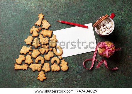 Gingerbread cookies christmas tree shape. Top view with greeting card for your text