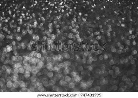 Silver glitter abstract bokeh background Christmas.