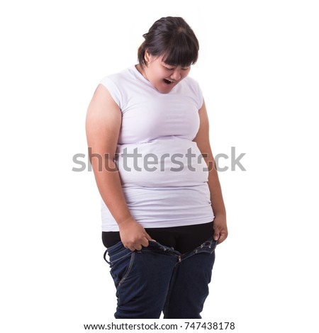 Fat asian woman trying to wear small size jeans isolated on white background. Fat and Healthcare concept