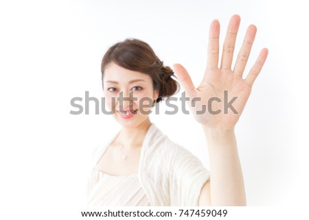 woman in dress waving her hands