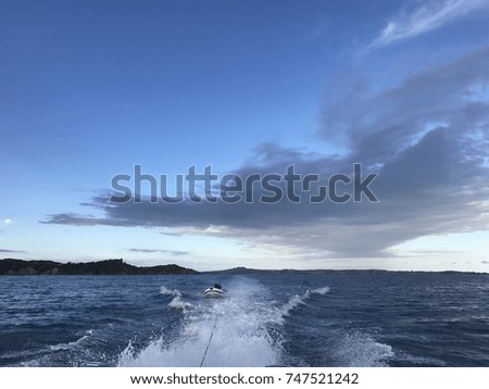 Rubber boat towed by speedboat
