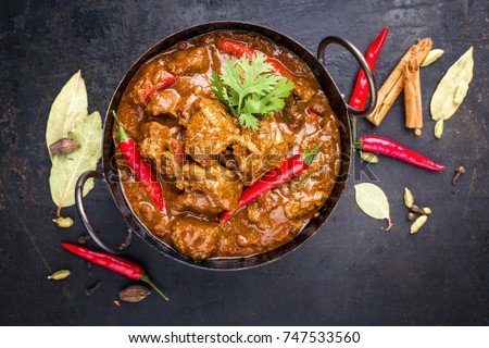 Traditional Indian curry lamb masala as close-up in a Korai  Royalty-Free Stock Photo #747533560