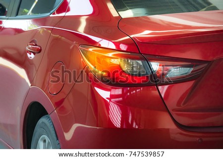 Car tail light red color for customers. Using wallpaper or background for transport and automotive image.