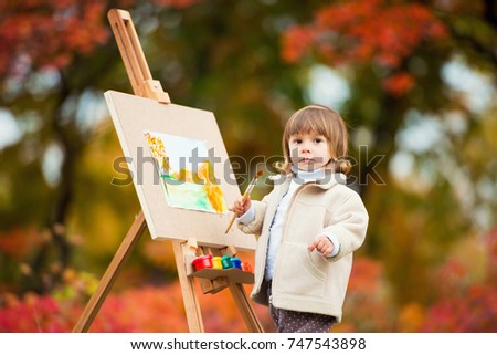 Autumn Baby Girl Drawing in Fall Leaves Park, Little Kid Painting, Children Creativity
