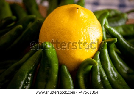 Photo food, lemon and green peppers.