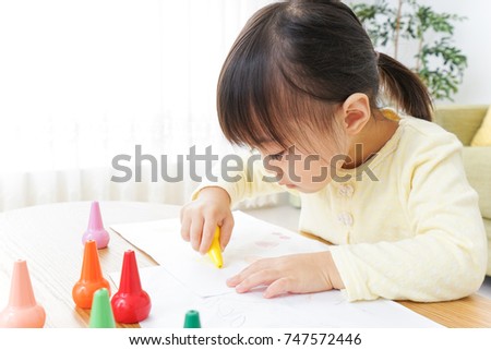A child painting pictures
