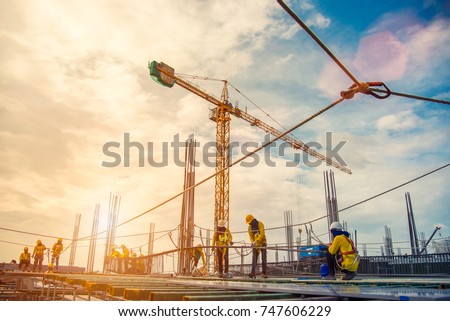 construction site and sunset , structural steel beam build large residential buildings at construction site . Royalty-Free Stock Photo #747606229