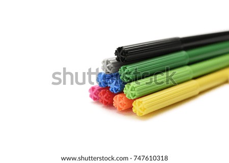Pyramid of markers on a white background side view