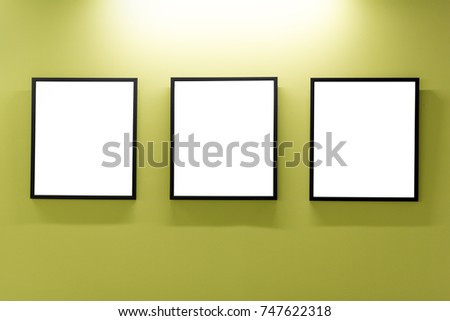 Mock up. Blank picture frames on yellow wall. Gallery wall with empty frames indoor