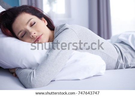 beautiful girl sleeps in the bedroom Royalty-Free Stock Photo #747643747