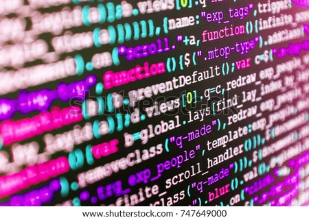 Website HTML Code on the Laptop Display Closeup Photo. Binary digits code editing. IT coding on monitor screen. PC software creation business. Desktop PC monitor photo. 
