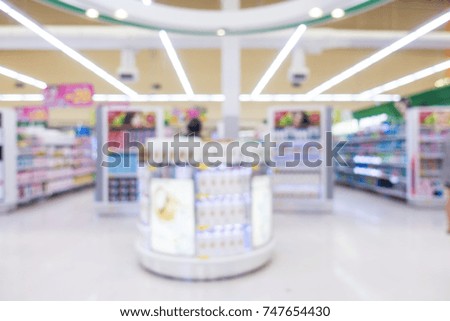 Abstract blur supermarket shopping in derpartment store interior for background