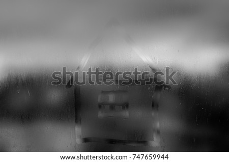 House in a wet window