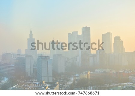 Characteristic view of a modern city skyline covered in a dense smog and pollution - Warsaw, Poland Royalty-Free Stock Photo #747668671