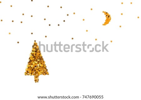 Christmas tree, moon and starry sky made of gold star shaped sequins. White background.