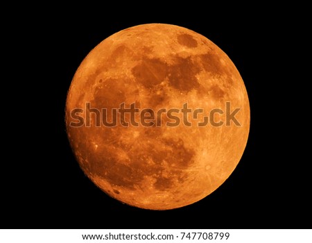 The yellow full moon on black background for your night and dark design concept. High Quality of full moon photo.