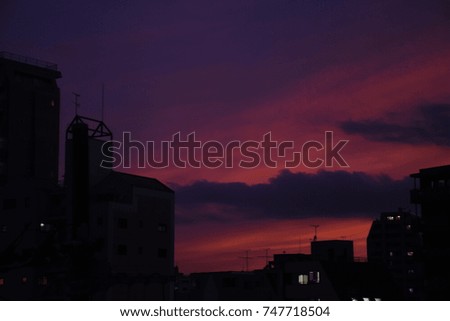 Twilight, at dusk of Tokyo. Sunset evening glow sky and buildings' silhouette.