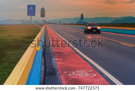 bicycle lane : bicycle sign on highway at sunset