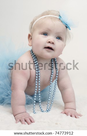 baby girl in a blue tutu
