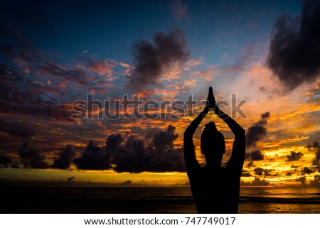 silhouette of a girl, greeting the sun yoga