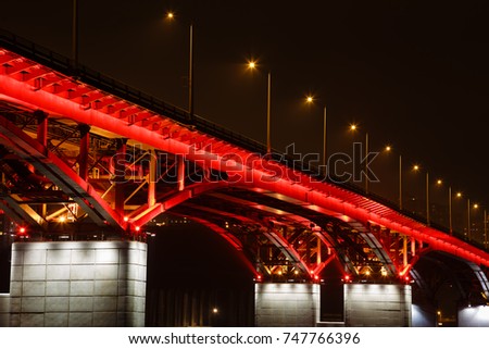 The bridge through the Yenisei River in Russia, Krasnoyarsk, in the downtown, the night picture, a long time of exhibiting