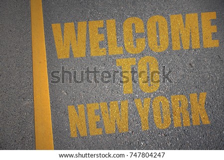asphalt road with text welcome to new york near yellow line. concept