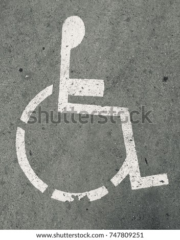 Street sign reserved for the handicapped