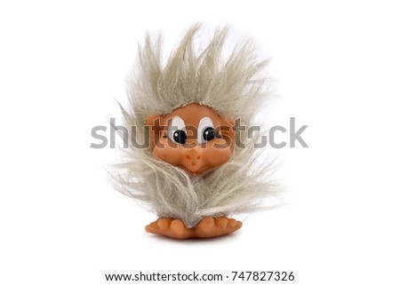 Troll stock images. Elf on a white background. Vintage hairy toy