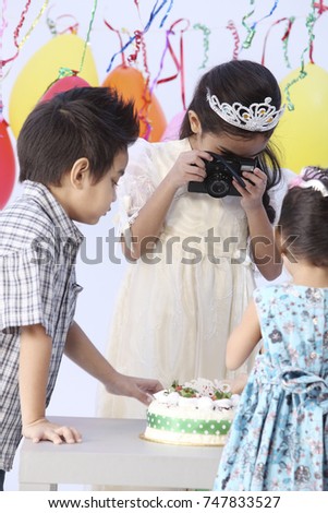 taking picture of birthday cake