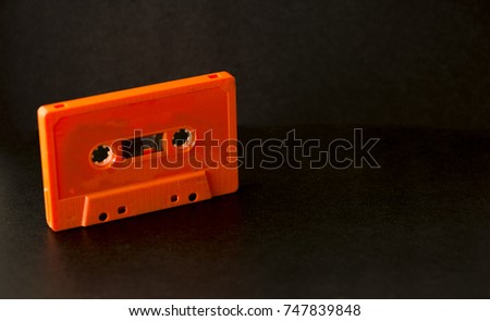 Old cassettes on a background of a black color