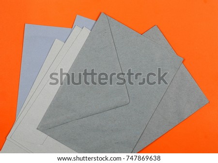 Blank blue envelope on orange background