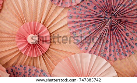 Red and pink paper origami circles