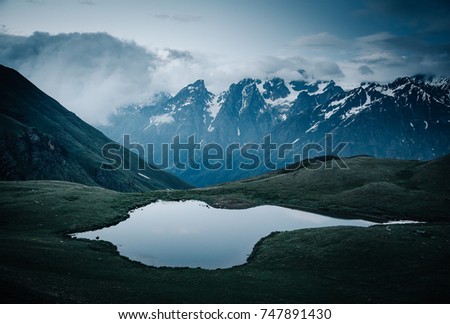 Lake Koruldi near Mt. Ushba. Location Upper Svaneti, Georgia country, Europe. Main Caucasian ridge. Scenic image of lifestyle hiking concept. Adventure trip vacation. Explore the beauty of earth.