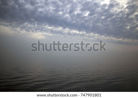 seascape landscape picture of sunset blue sky blue sea with cloud