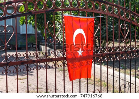 Turkish Flag on a fence of a private house