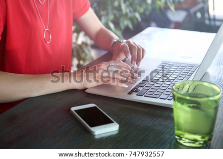 Young woman with laptop at table