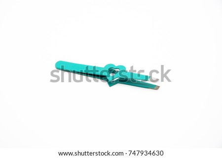 Turquoise tweezers with a heart isolated