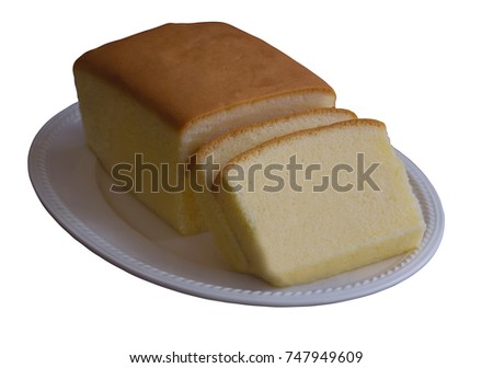 White isolated background with clipping paths slices of delicious butter cake or pound on white plate. Homemade bakery concept with copy space.