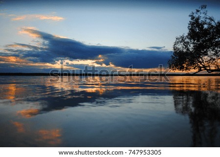 sunset with ordinary clouds and beautiful reflection of water
