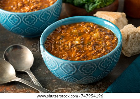 A bowl of delicious hearty homemade curried lentil soup. Royalty-Free Stock Photo #747954196