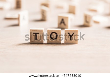 wooden elements with the letters collected in the word toy