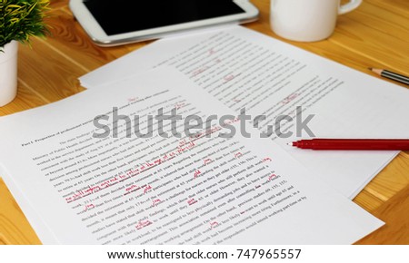 hand working on paper for proofreading Royalty-Free Stock Photo #747965557