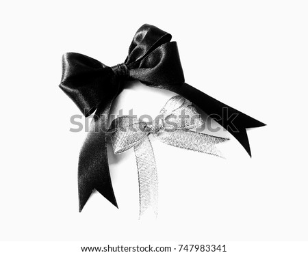 Black and white pattern of ribbons on white background.