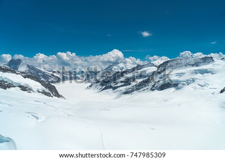 Spectacular view of the Aletsch glacier, bordered by four thousand meter peaks in the Bernese Alps, Switzerland Royalty-Free Stock Photo #747985309