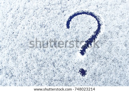 Snow texture with question mark. Picture on the snow surface