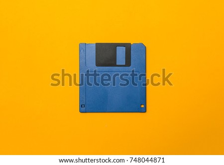 Blue diskette on yellow background
