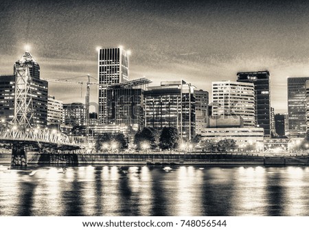 Beautiful night view of Downtown Portand and Willamette River reflections.