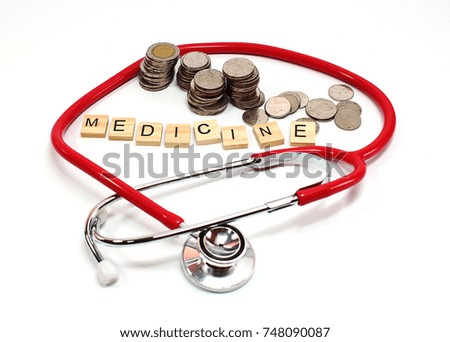 Cost of medicine.healthcare budget concept.stethoscope and pills on a white table.Metaphor about struggle for profit in the pharmaceutical industry.